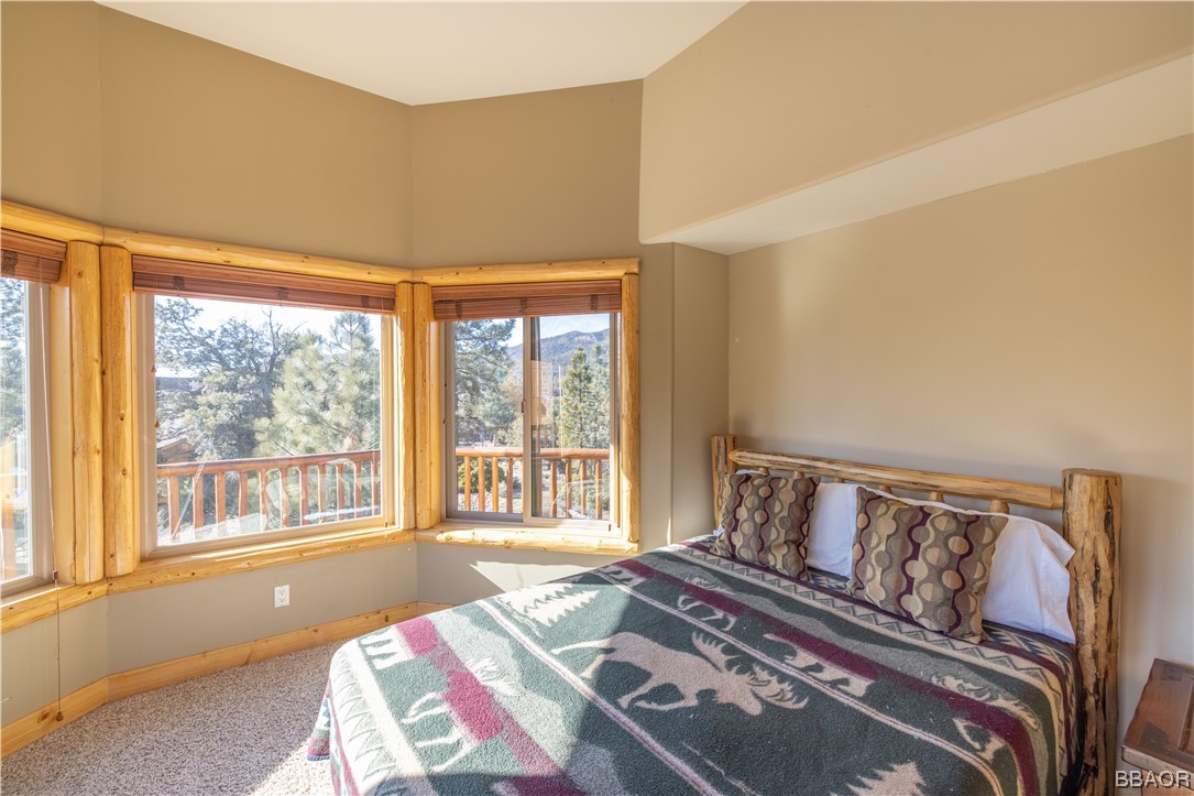 42324 Eagle Ridge Big Bear Lake, CA 92315 - Photo 47 of 50 a bedroom with a bed and a large window