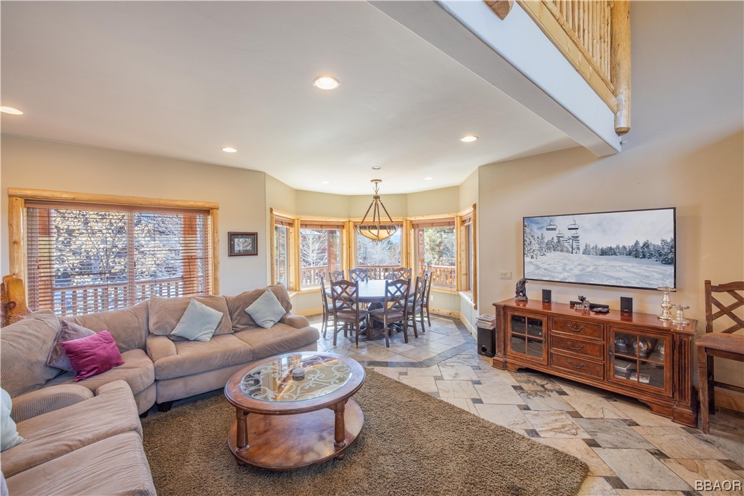 42324 Eagle Ridge Big Bear Lake, CA 92315 - Photo 10 of 50 a living room with furniture a rug and a large window