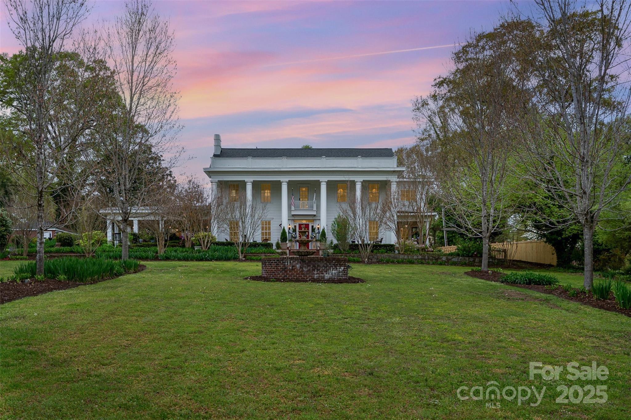 a front view of house with a garden and patio