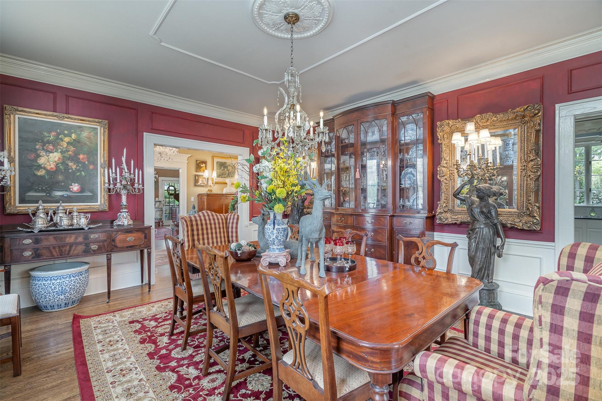 1313 South York Road Gastonia, NC 28052 - Photo 14 of 45 a dining room with furniture a chandelier and window