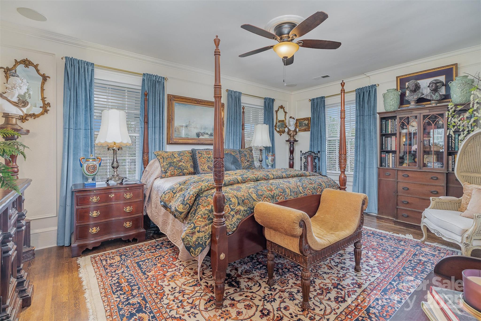 1313 South York Road Gastonia, NC 28052 - Photo 22 of 45 a bedroom with a bed and a chandelier