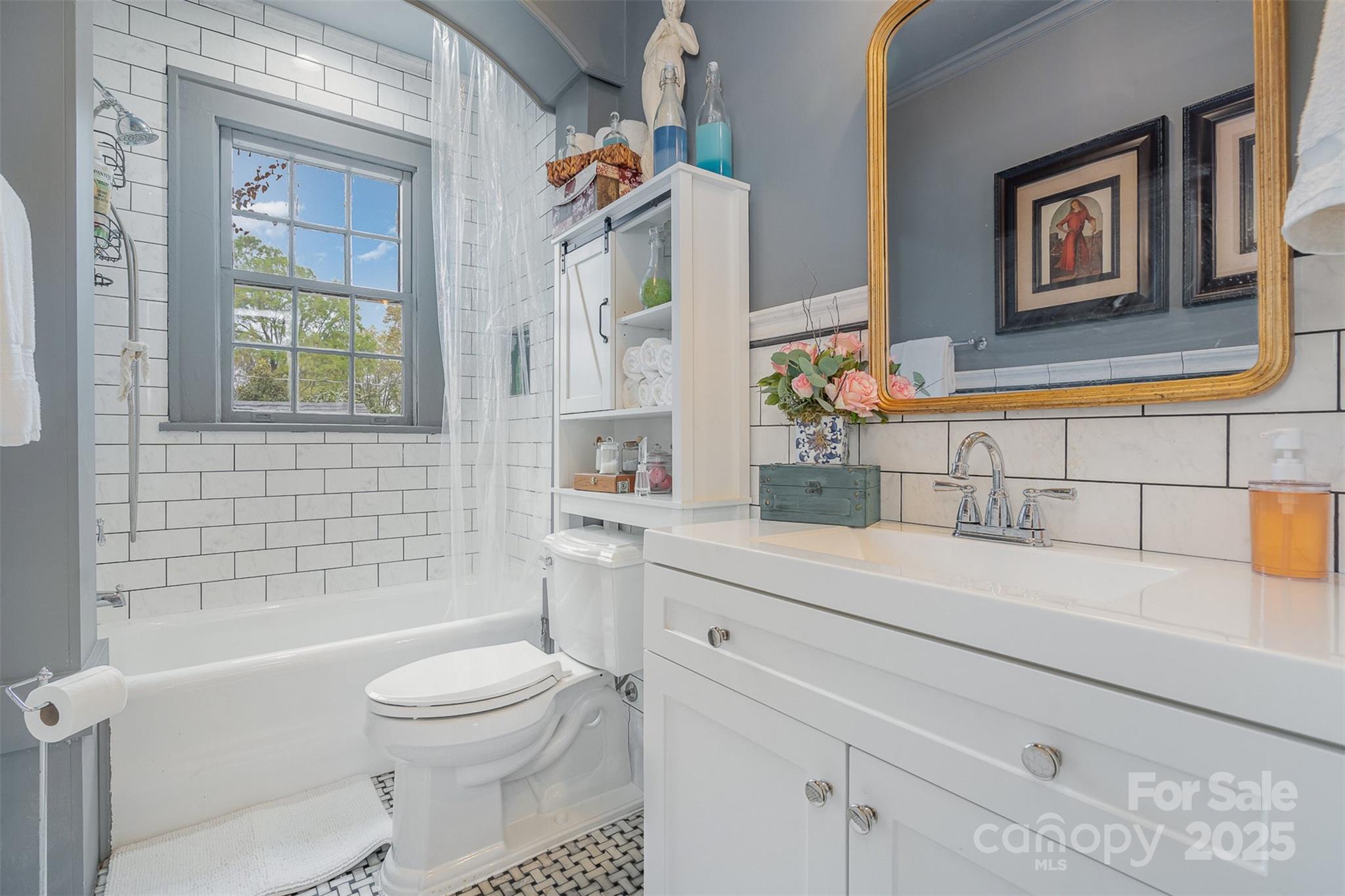 1313 South York Road Gastonia, NC 28052 - Photo 24 of 45 a bathroom with a sink a toilet and shower