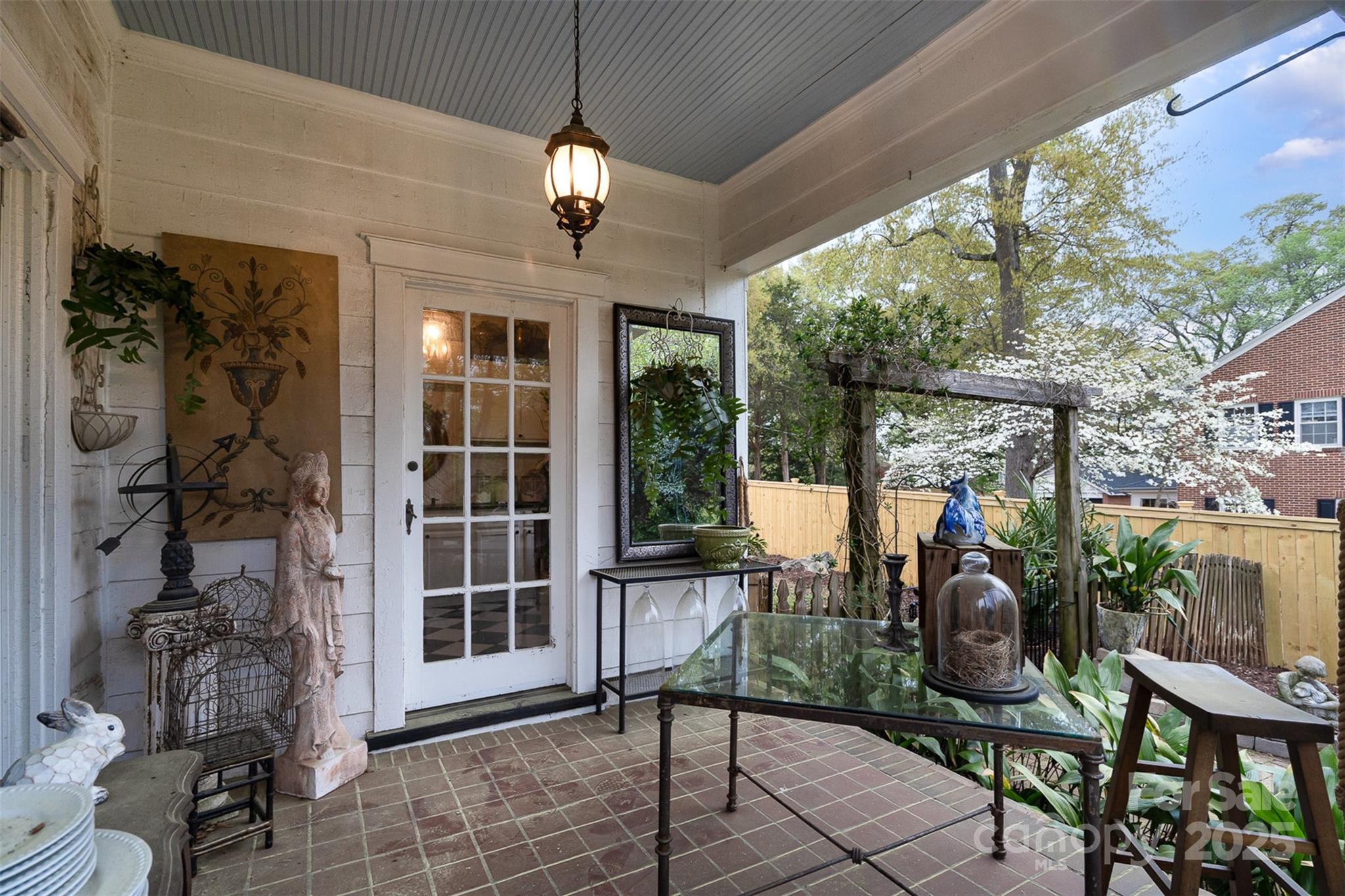 1313 South York Road Gastonia, NC 28052 - Photo 29 of 45 a view of a porch with chairs and potted plants