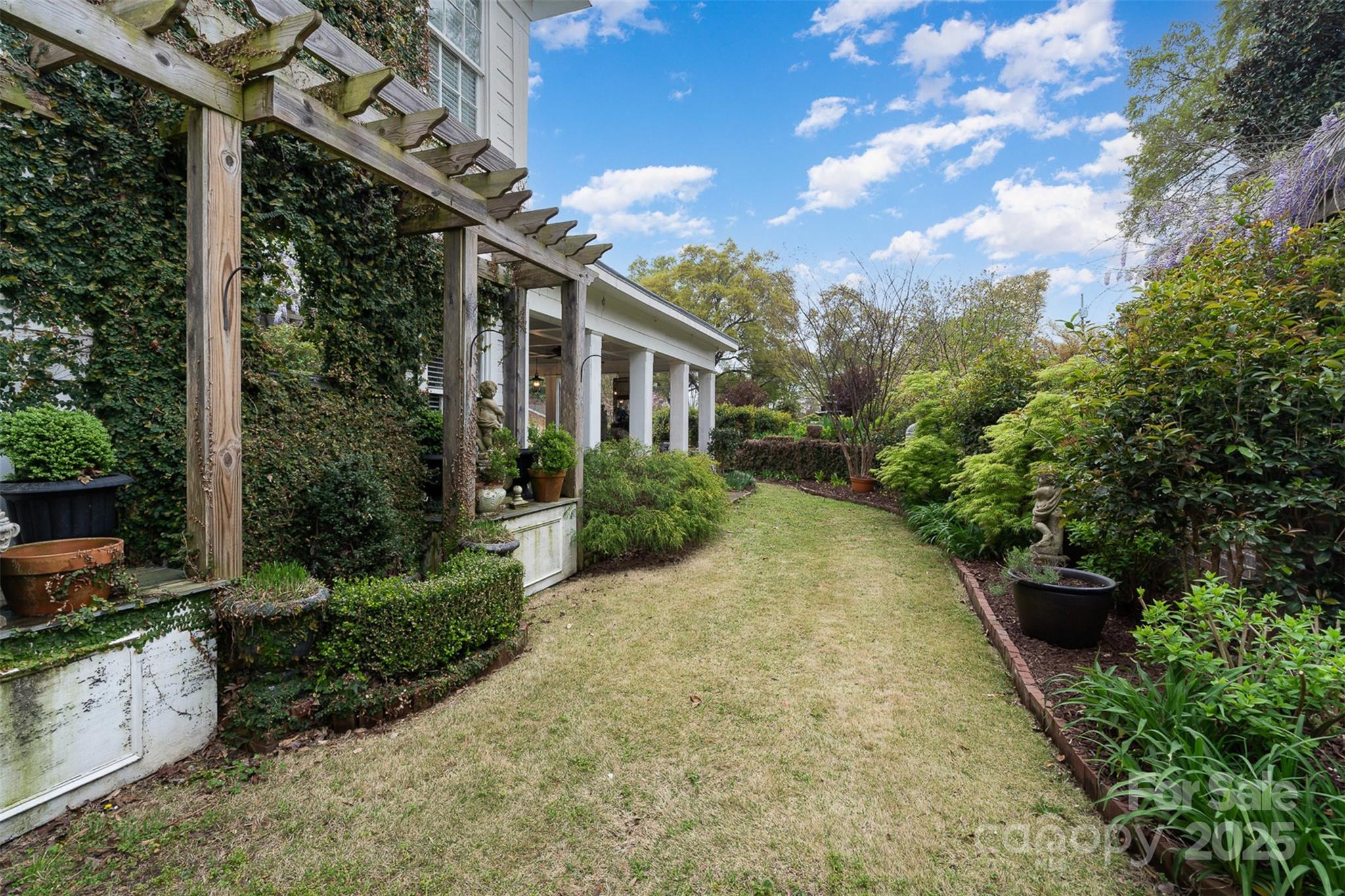 1313 South York Road Gastonia, NC 28052 - Photo 42 of 45 a view of a backyard with plants and a patio