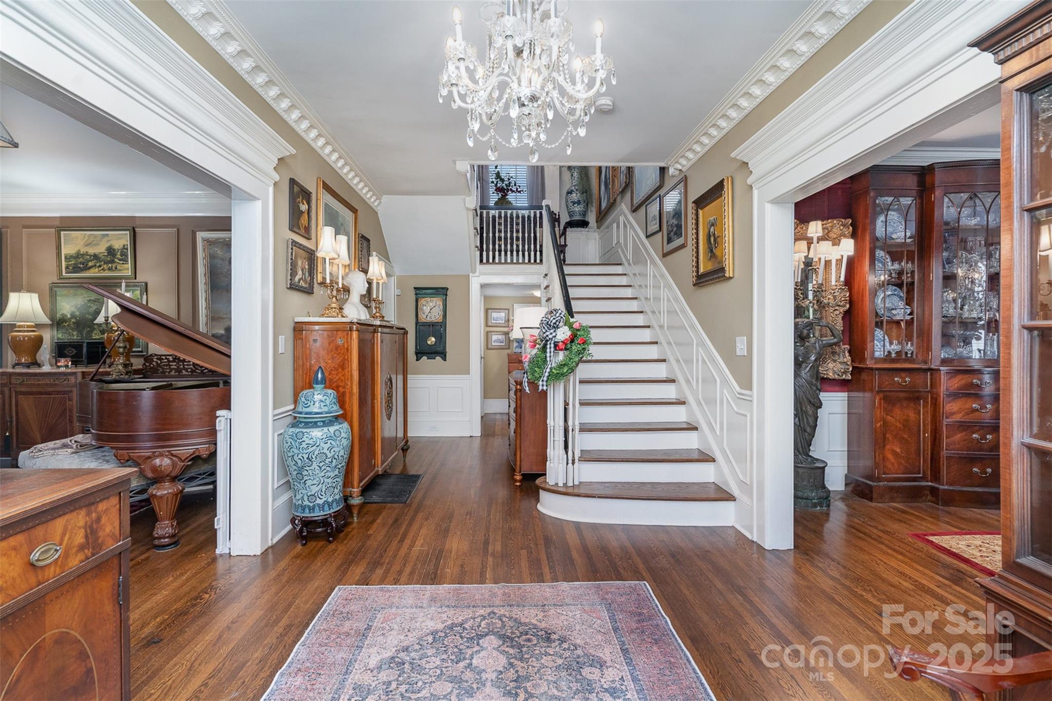 1313 South York Road Gastonia, NC 28052 - Photo 8 of 45 a view of a hallway with wooden floor and staircase