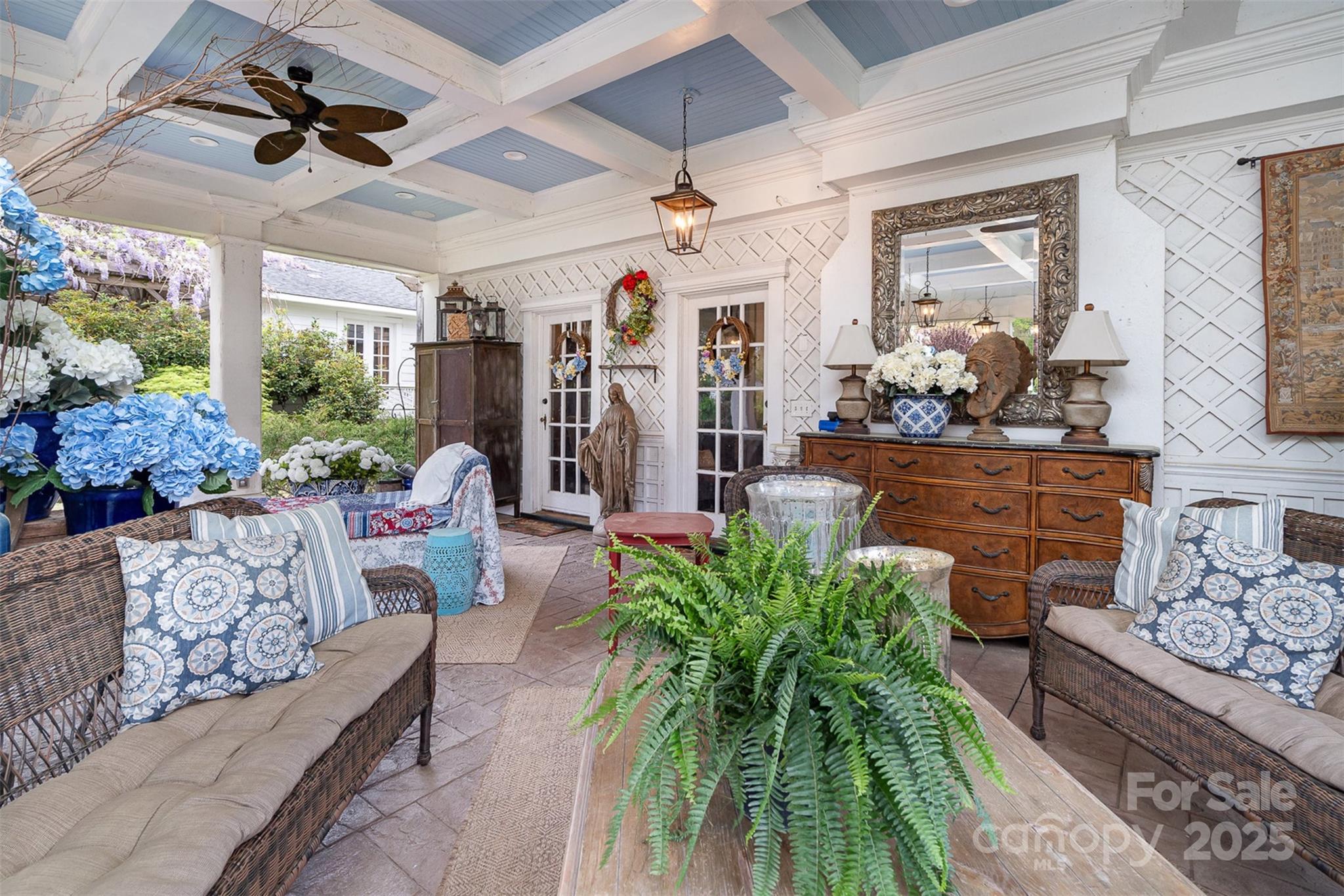 1313 South York Road Gastonia, NC 28052 - Photo 9 of 45 a living room with patio furniture and a potted plant