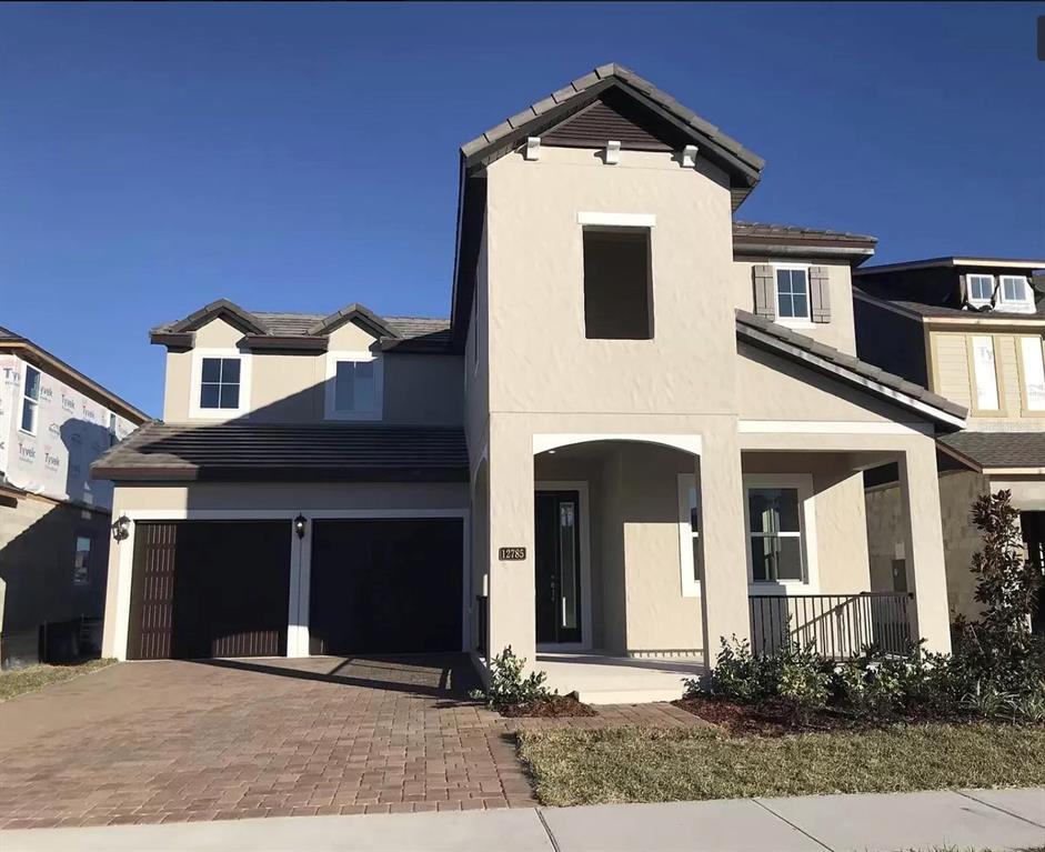 12785 Westside Vlg Loop Windermere, FL 34786 - Photo 1 of 1 a front view of a house with yard