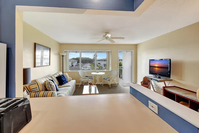 a bedroom with furniture and a flat screen tv