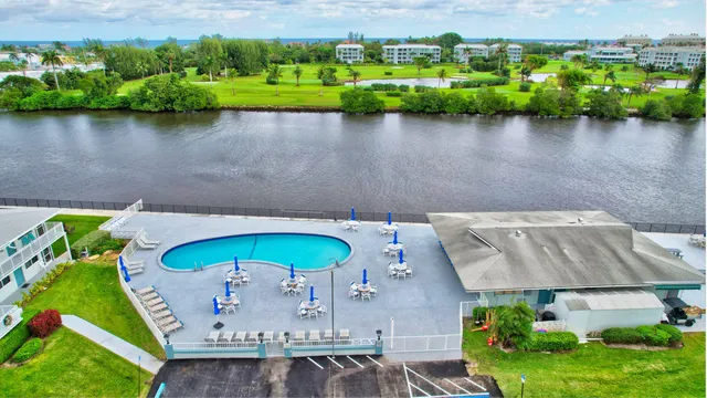 an aerial view of a house with a lake view
