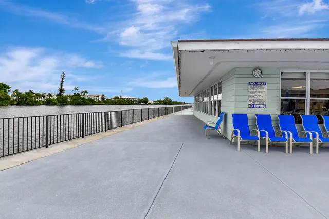 a view of a terrace with furniture and a yard