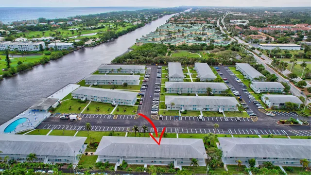 an aerial view of a houses with a yard