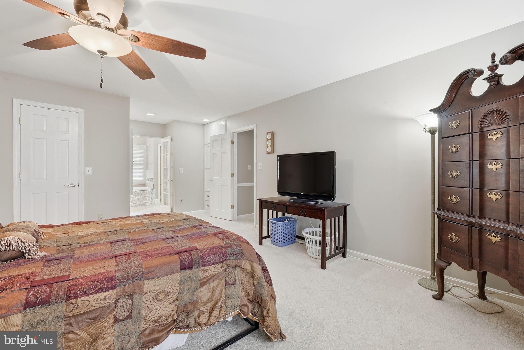 140 Hoile Lane Huntingtown, MD 20639 - Photo 22 of 44 a bedroom with a bed and a television