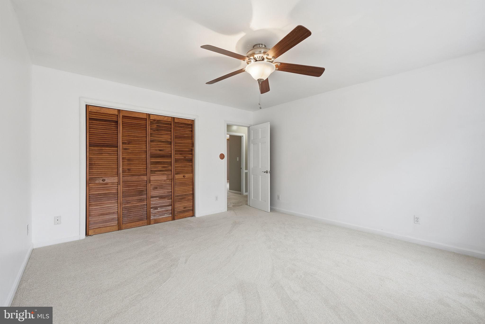 140 Hoile Lane Huntingtown, MD 20639 - Photo 30 of 44 a view of an empty room with a ceiling fan