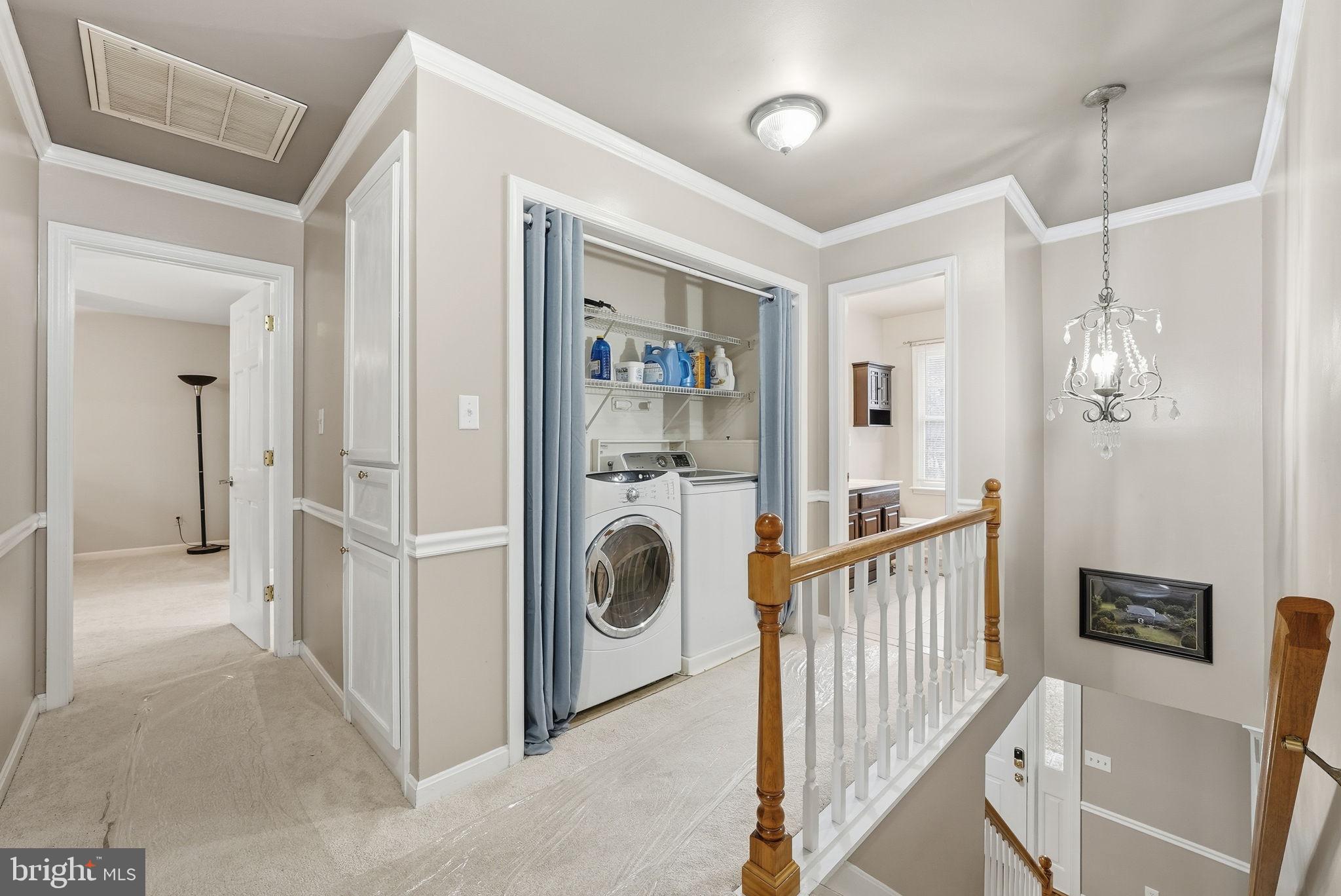 140 Hoile Lane Huntingtown, MD 20639 - Photo 31 of 44 a view of a hallway with washer and dryer