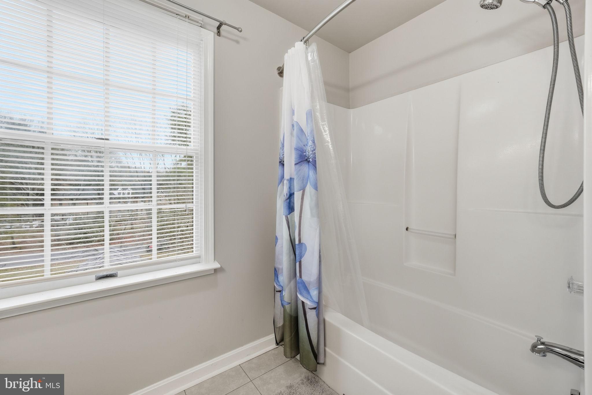 140 Hoile Lane Huntingtown, MD 20639 - Photo 33 of 44 a bathroom with a bathtub and a shower