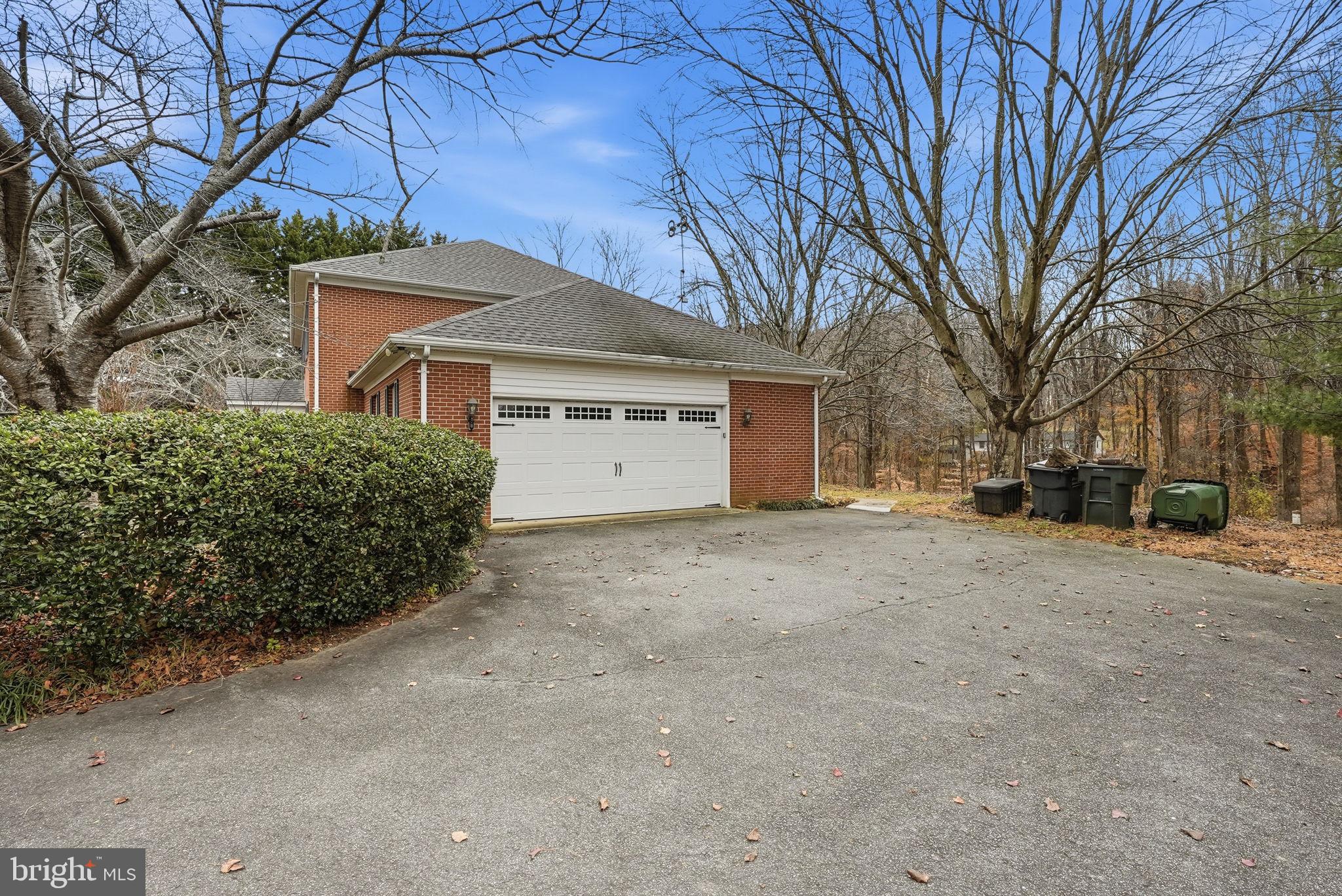 140 Hoile Lane Huntingtown, MD 20639 - Photo 38 of 44 a view of a house with a yard and garage