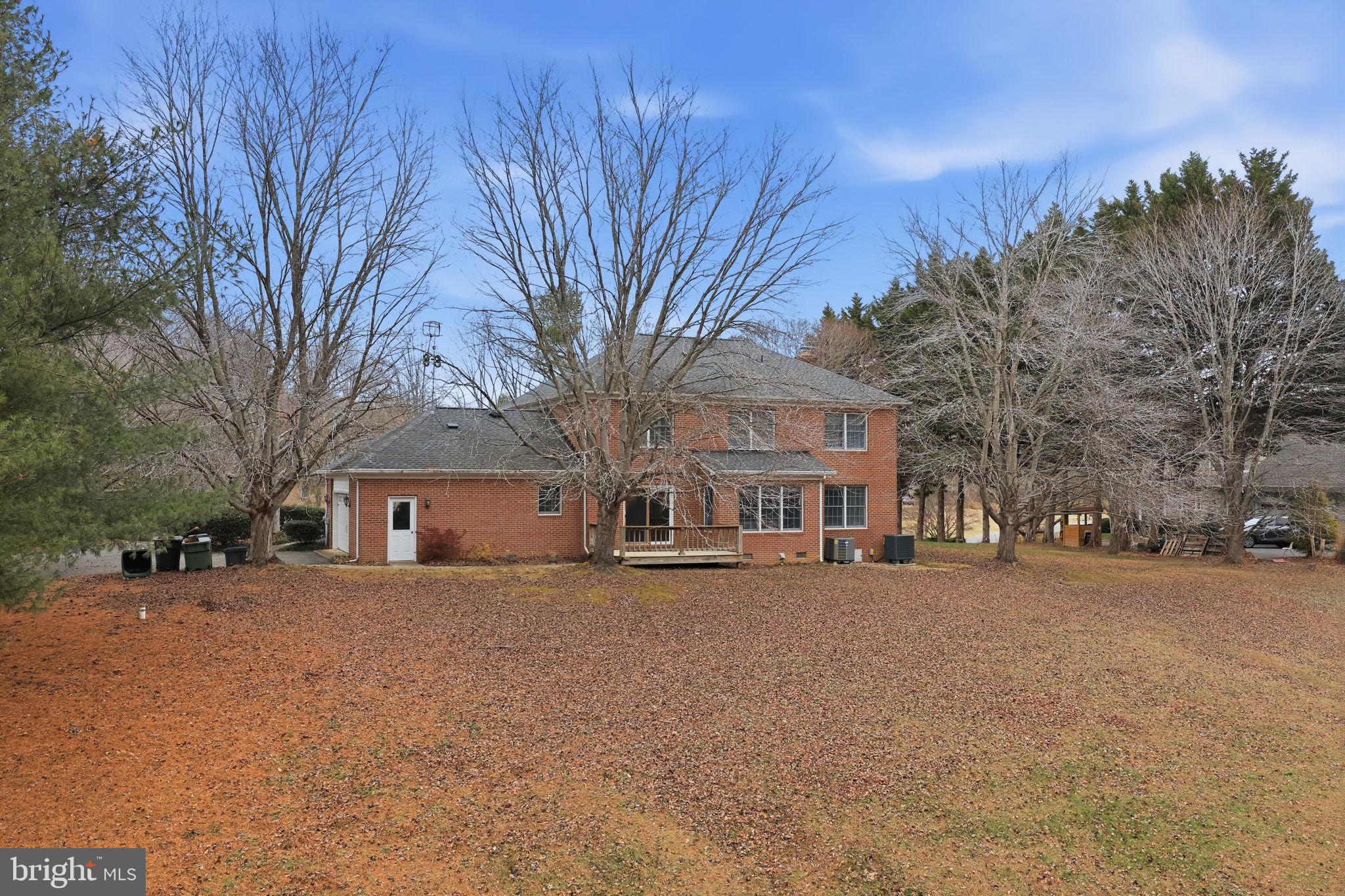 140 Hoile Lane Huntingtown, MD 20639 - Photo 41 of 44 a large house with a large tree in front of it