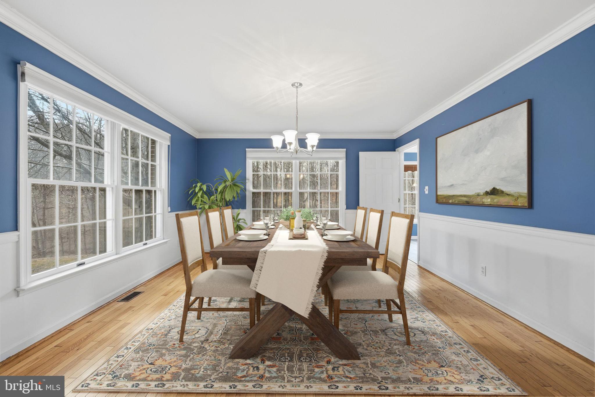 140 Hoile Lane Huntingtown, MD 20639 - Photo 7 of 44 a dining room with furniture a rug and wooden floor