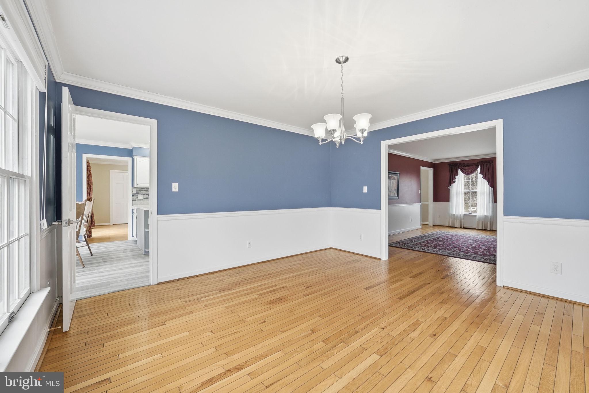 140 Hoile Lane Huntingtown, MD 20639 - Photo 8 of 44 a view of a livingroom with wooden floor and a large window