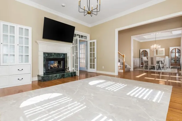 a living room with fireplace furniture and a flat screen tv