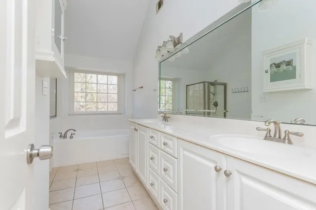 a white bath tub sitting next to a window