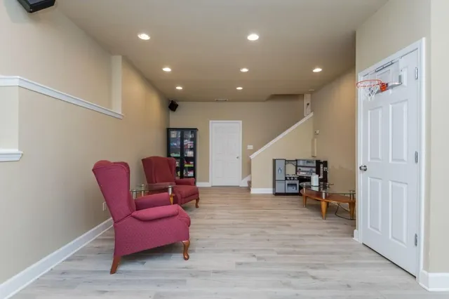 a bathroom with a toilet a sink and a mirror