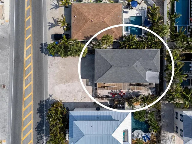 an aerial view of a house with a swimming pool