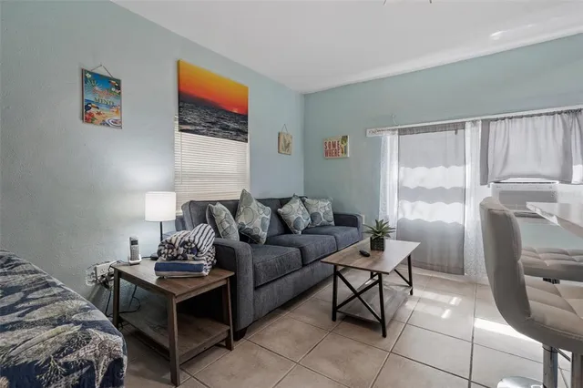 a living room with furniture and a window