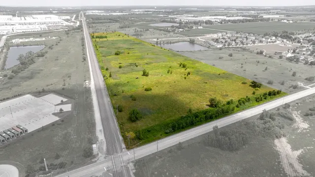 a view of a swimming pool and an outdoor seating