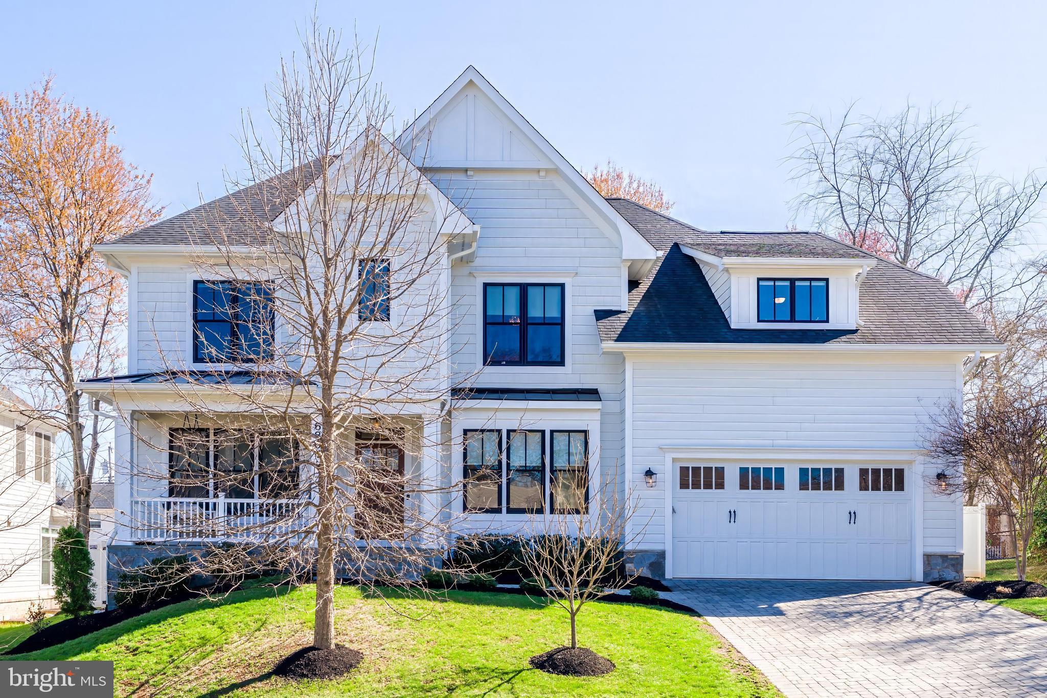 6805 Lumsden Street McLean, VA 22101 - Photo 1 of 123 a front view of a house with a yard