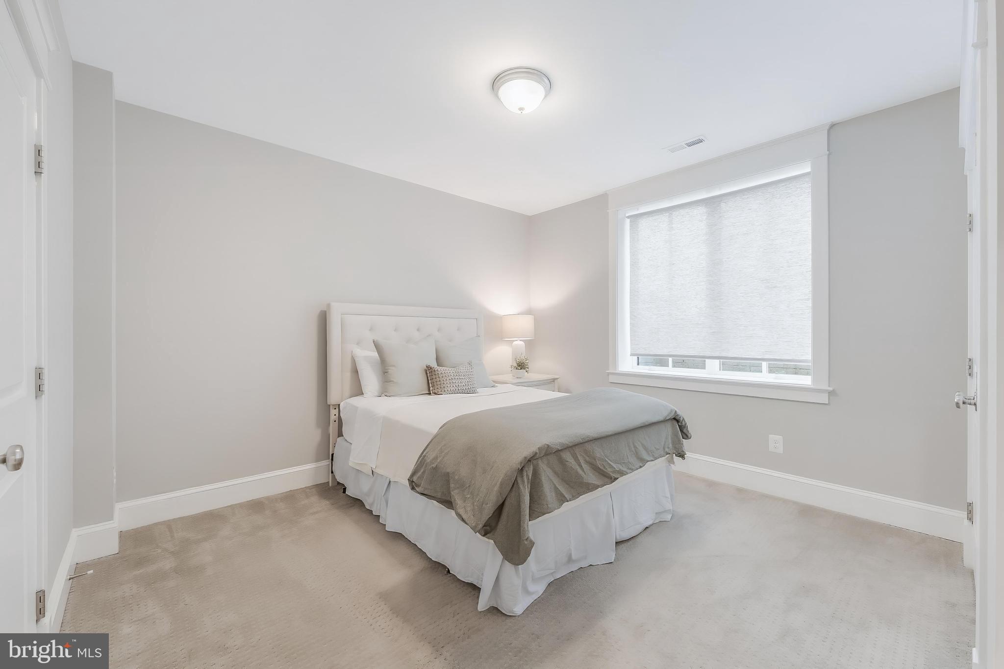 6805 Lumsden Street McLean, VA 22101 - Photo 106 of 123 a bed room with a bed and a window