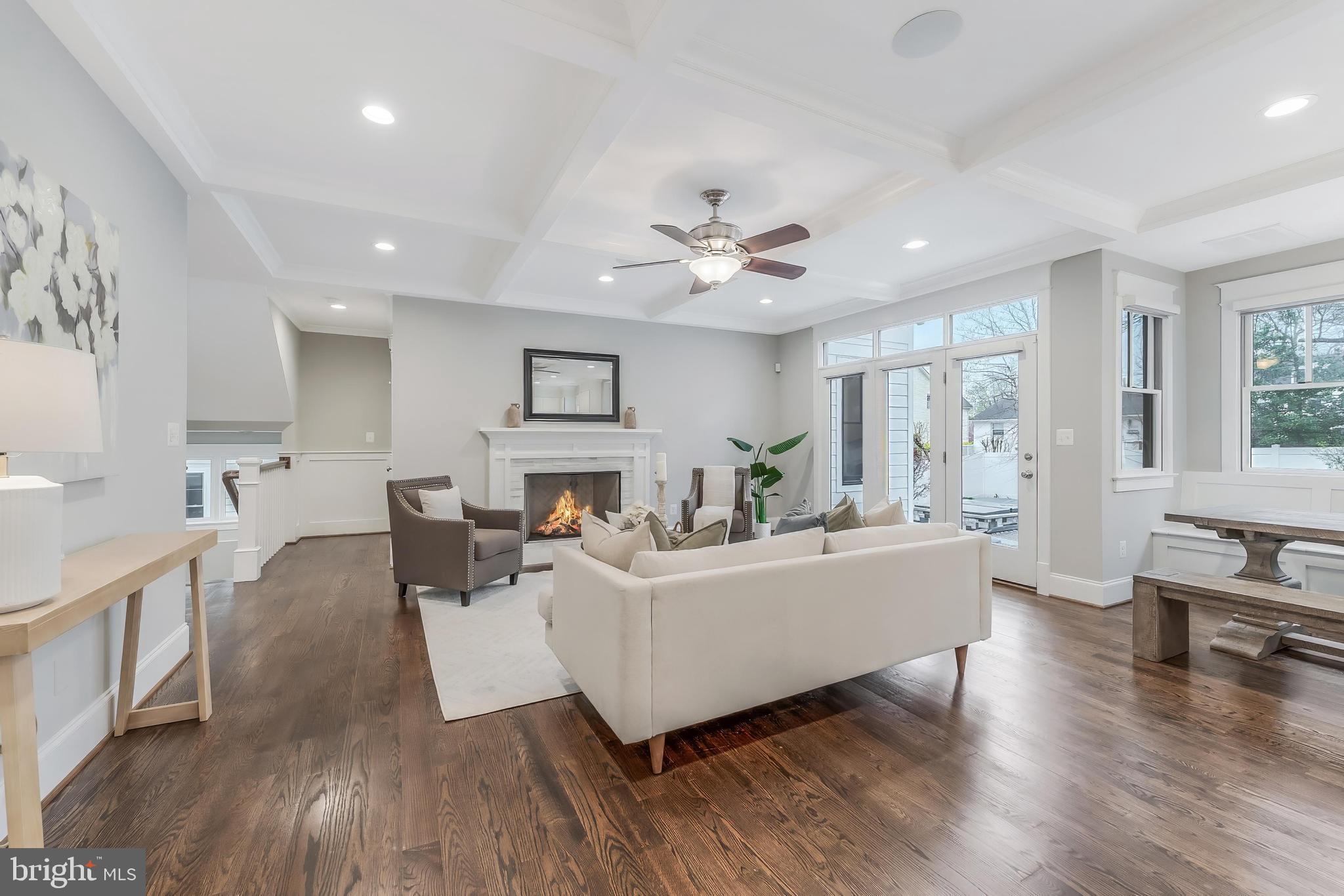 6805 Lumsden Street McLean, VA 22101 - Photo 24 of 123 a living room with furniture a fireplace and a table