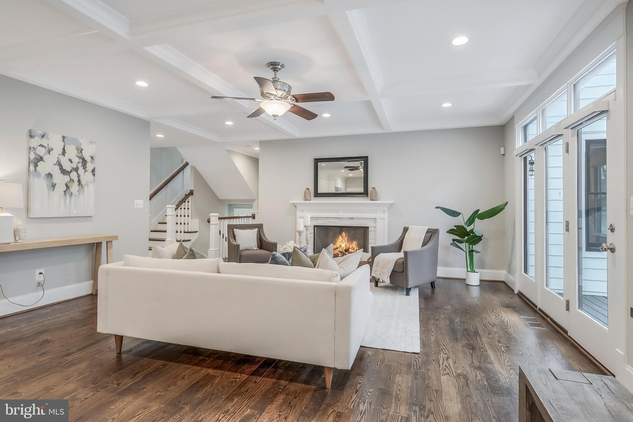 6805 Lumsden Street McLean, VA 22101 - Photo 26 of 123 a living room with furniture a fireplace and a potted plant