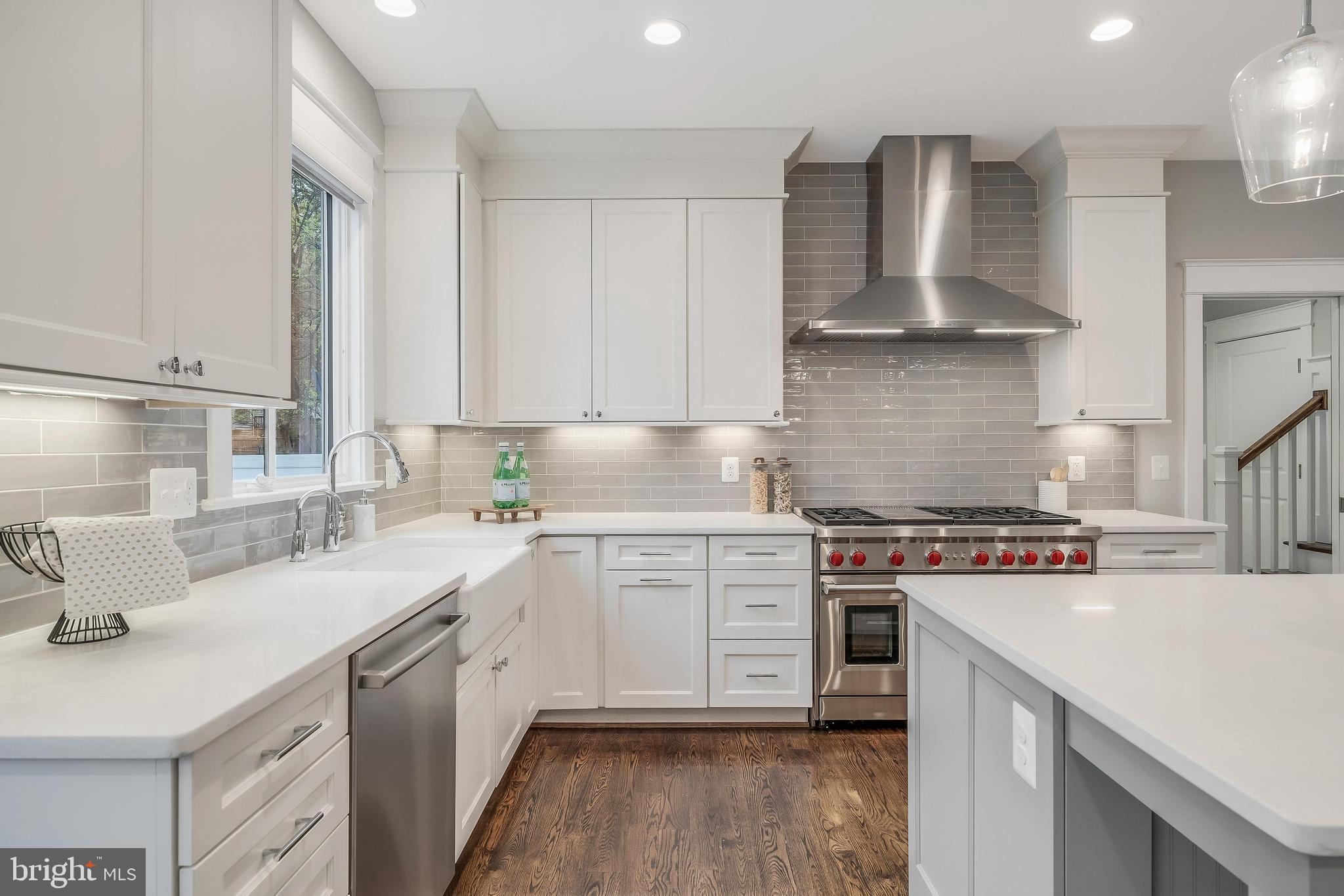 6805 Lumsden Street McLean, VA 22101 - Photo 35 of 123 a kitchen with stainless steel appliances a sink stove and cabinets