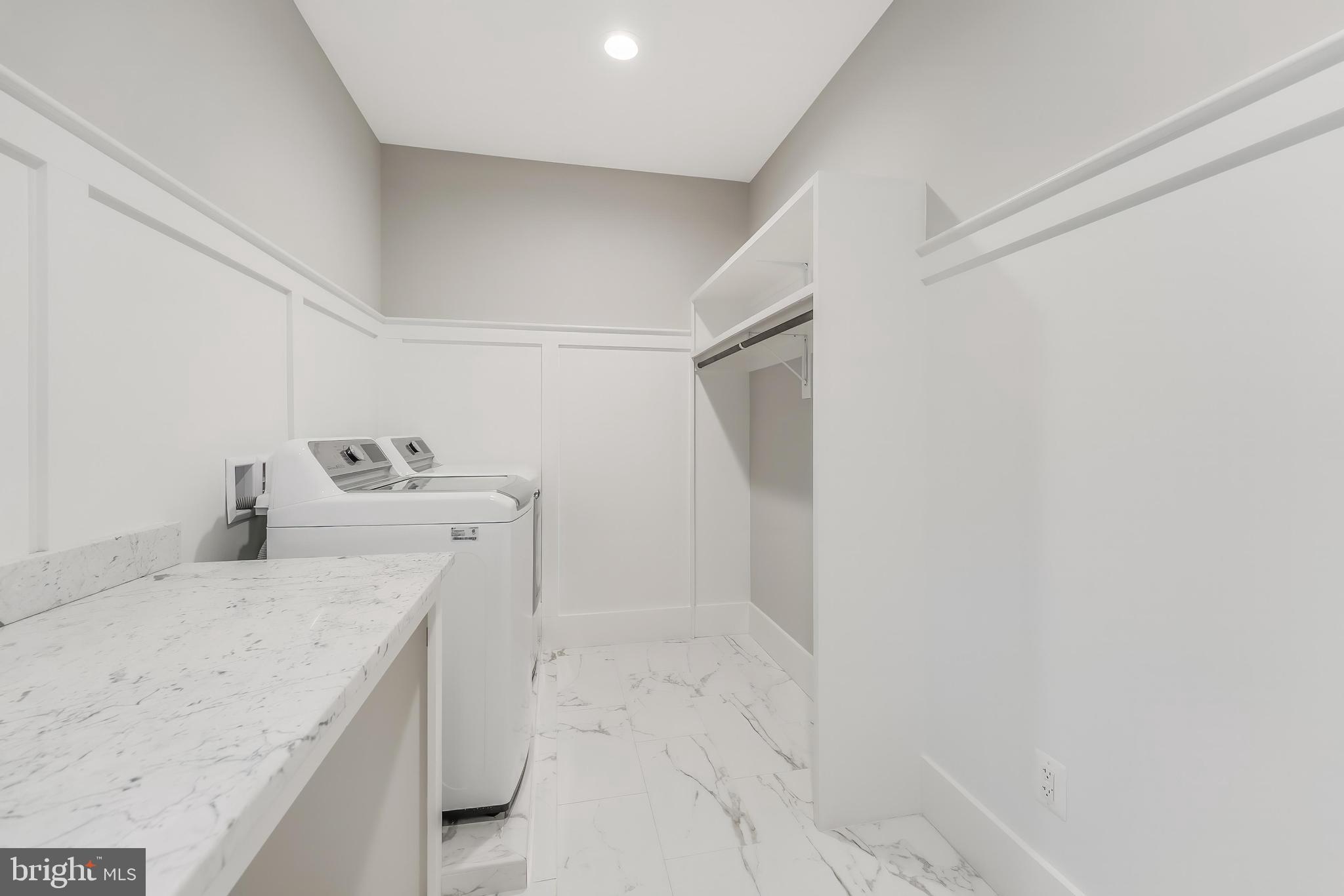 6805 Lumsden Street McLean, VA 22101 - Photo 57 of 123 a utility room with a sink dryer and washer