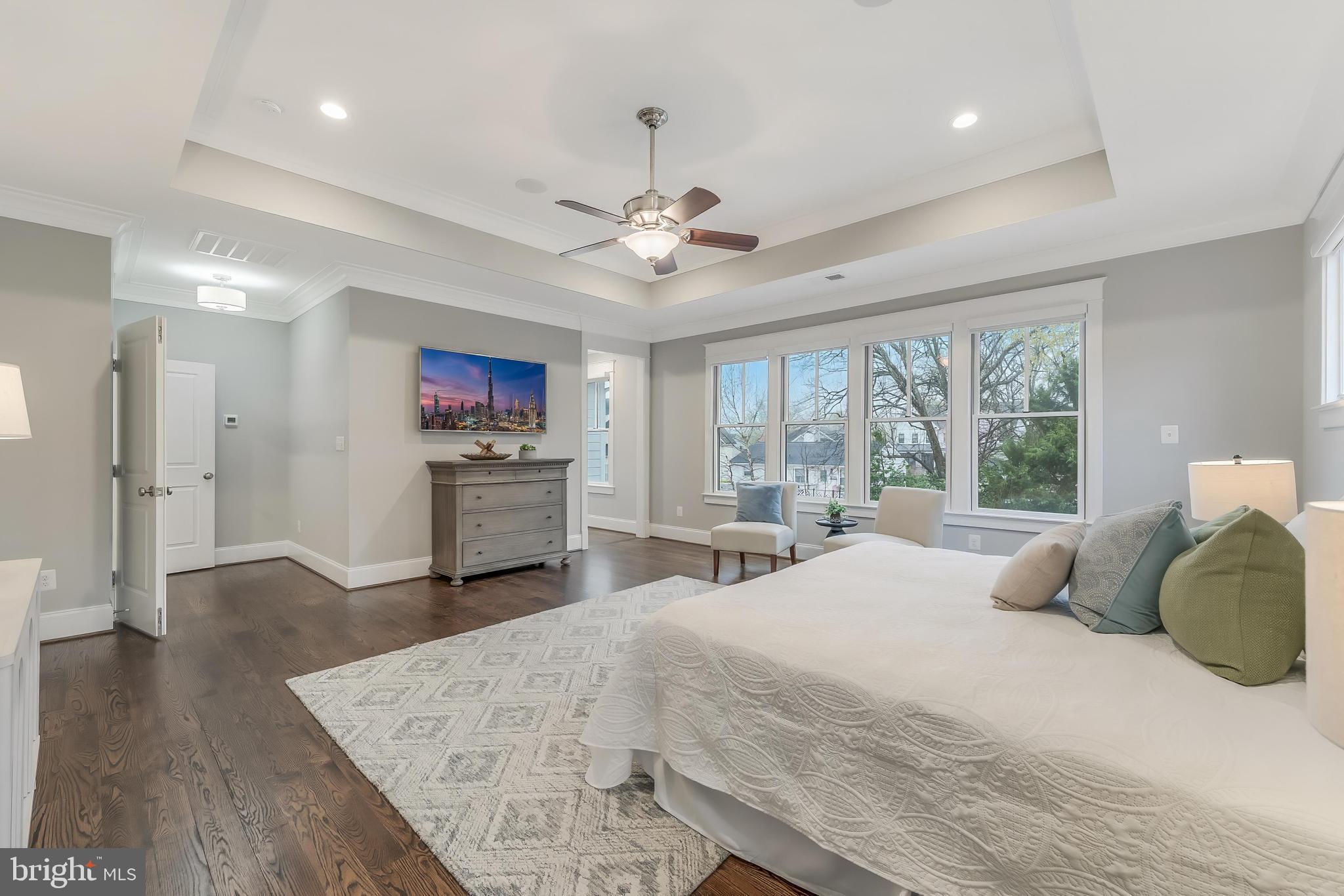 6805 Lumsden Street McLean, VA 22101 - Photo 60 of 123 a bedroom with a large bed and a chandelier