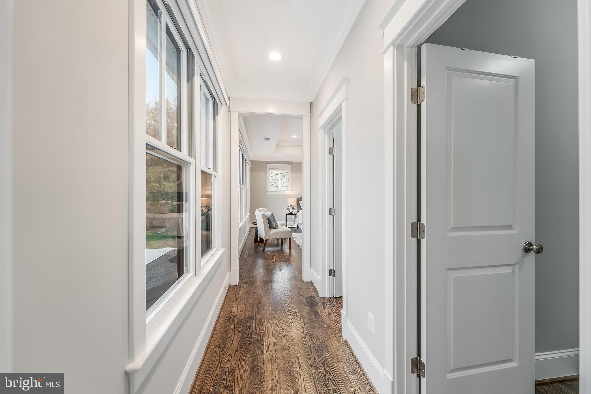 6805 Lumsden Street McLean, VA 22101 - Photo 65 of 123 a view of a hallway with wooden floor and staircase