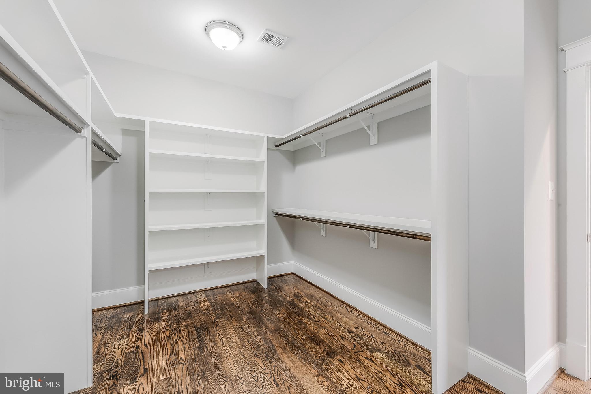 6805 Lumsden Street McLean, VA 22101 - Photo 68 of 123 a room with walk in closet and wooden floor