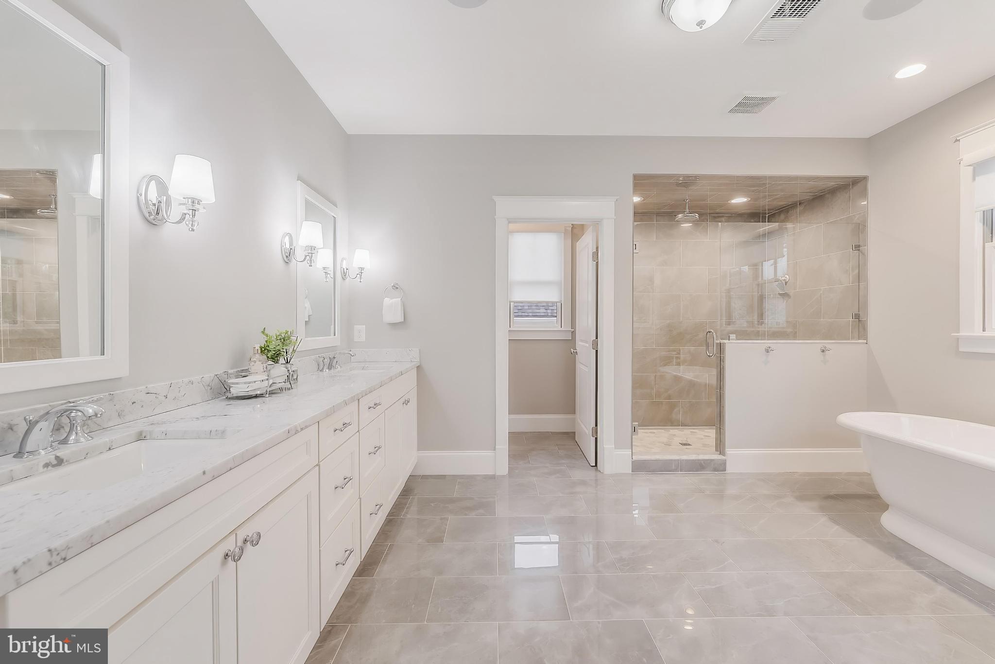 6805 Lumsden Street McLean, VA 22101 - Photo 69 of 123 a spacious bathroom with a double vanity sink toilet and shower