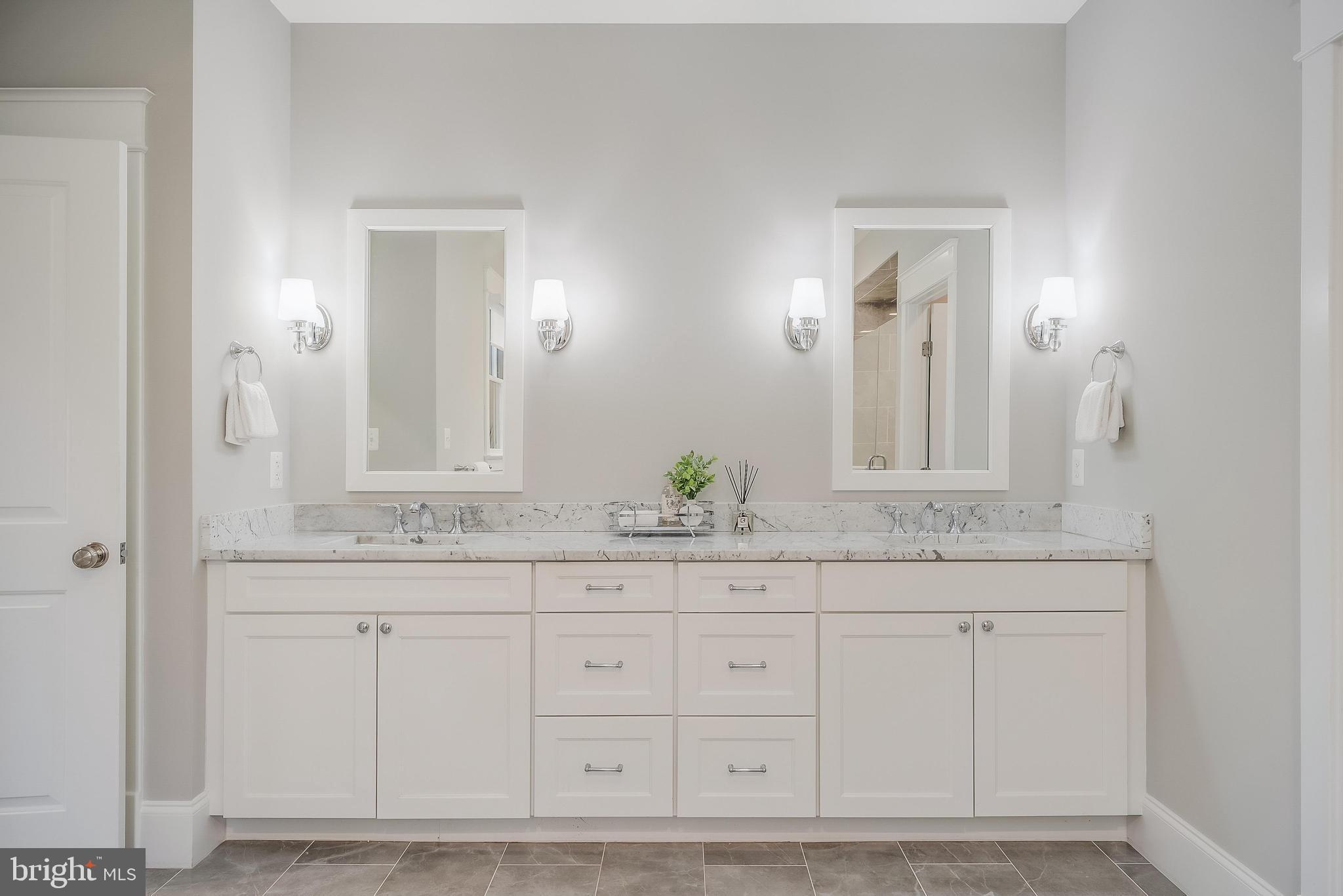 6805 Lumsden Street McLean, VA 22101 - Photo 73 of 123 a bathroom with white cabinets and sink