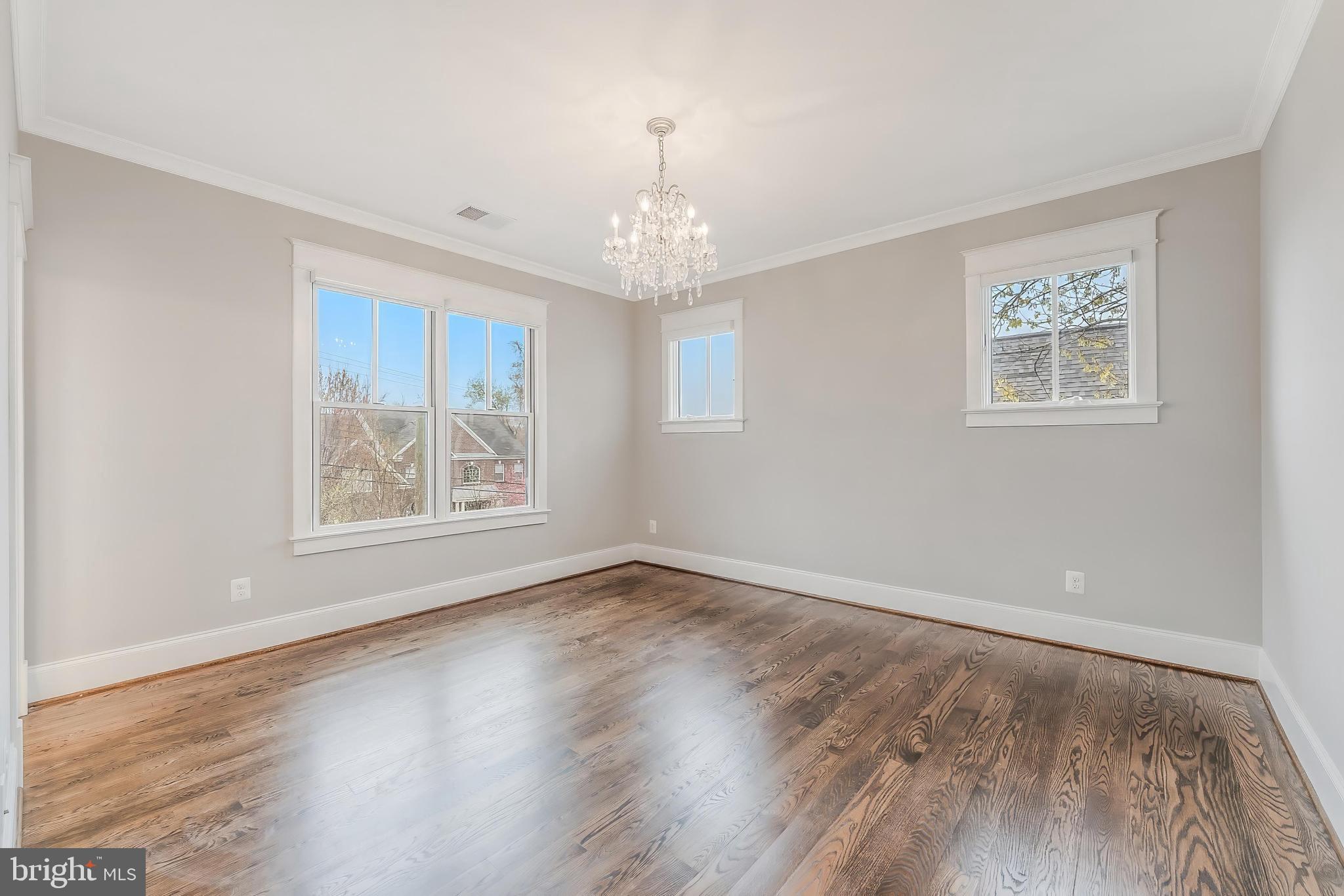 6805 Lumsden Street McLean, VA 22101 - Photo 76 of 123 a view of an empty room with wooden floor and a window