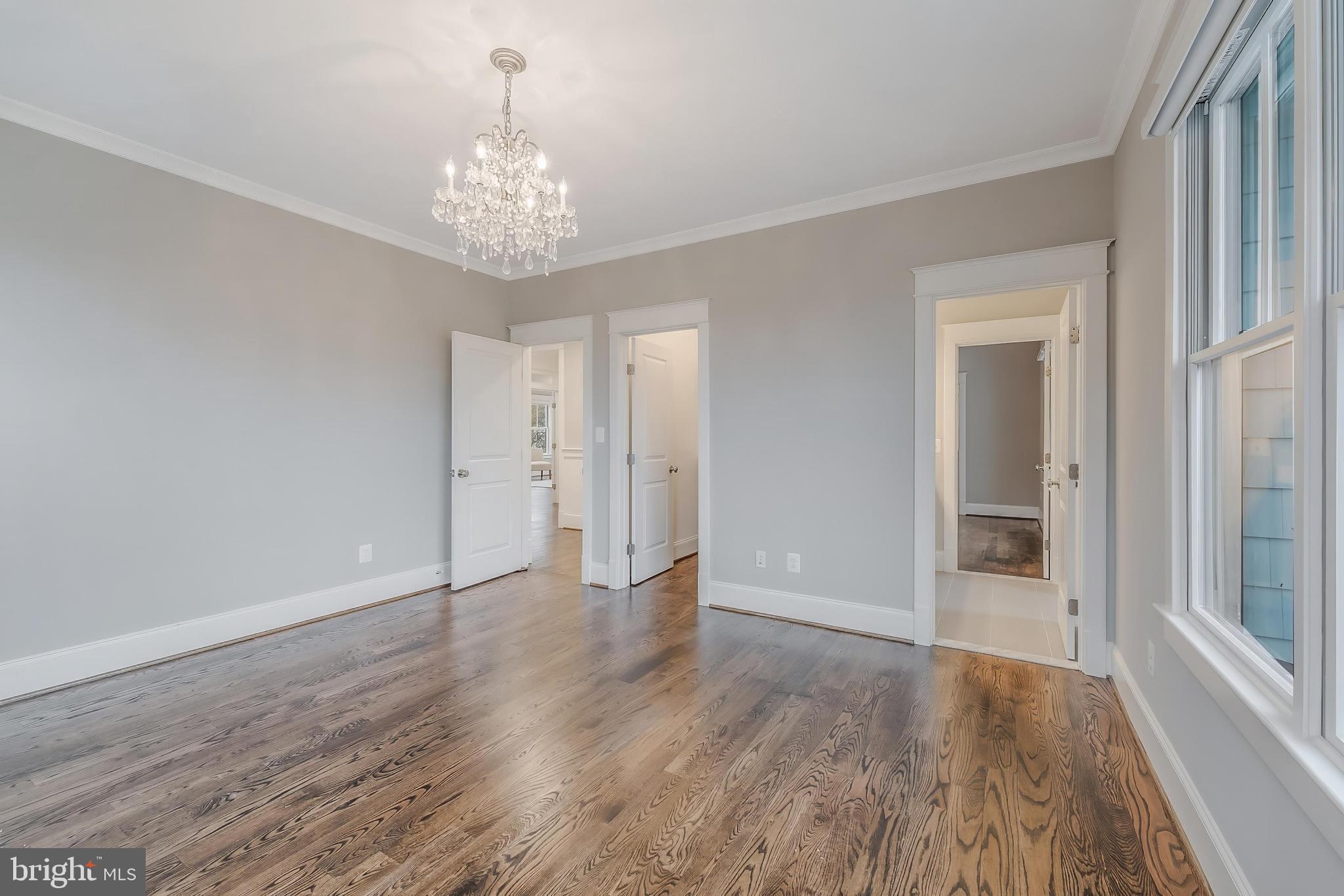 6805 Lumsden Street McLean, VA 22101 - Photo 78 of 123 a view of an empty room with wooden floor and a window