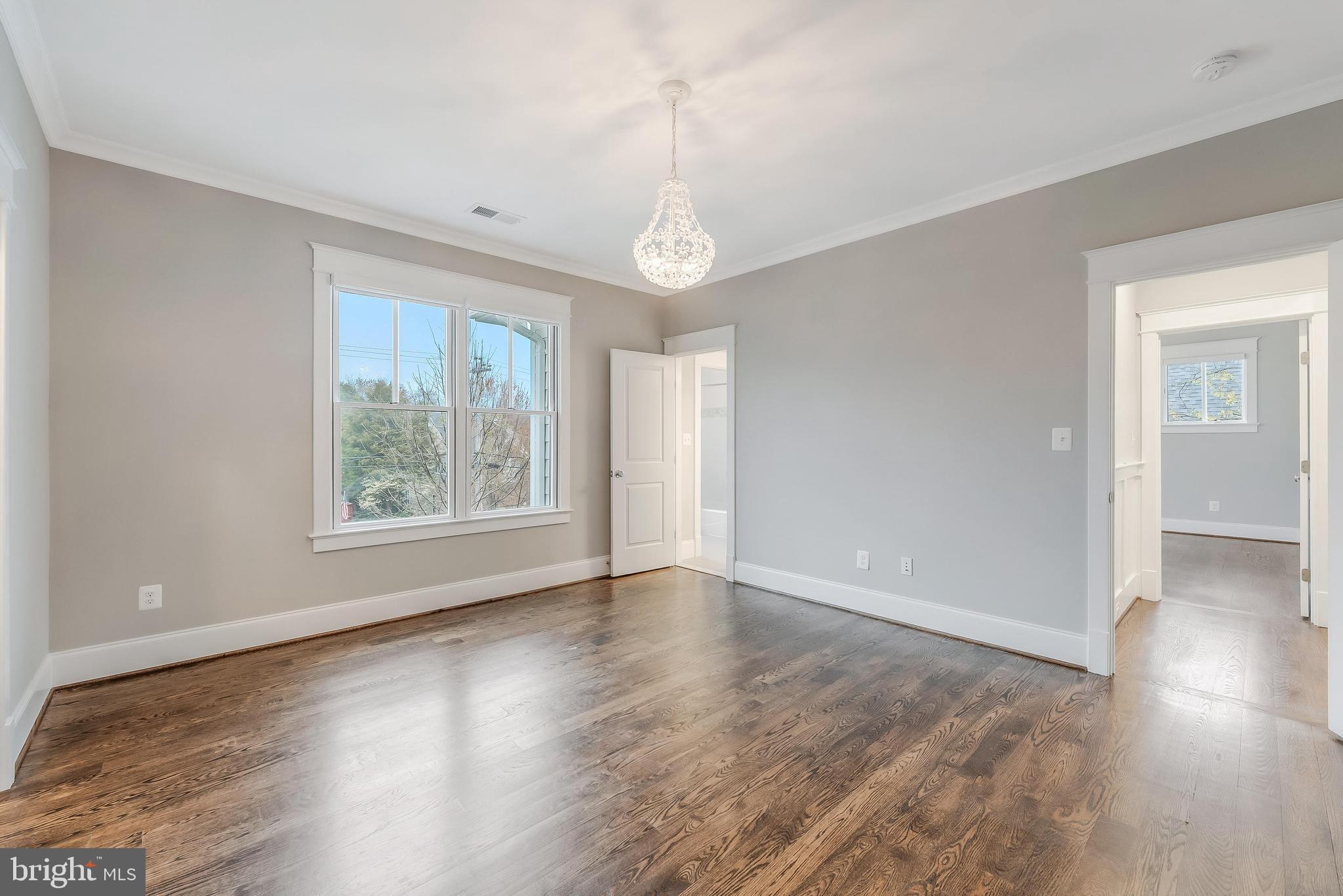 6805 Lumsden Street McLean, VA 22101 - Photo 84 of 123 a view of an empty room with wooden floor and a window