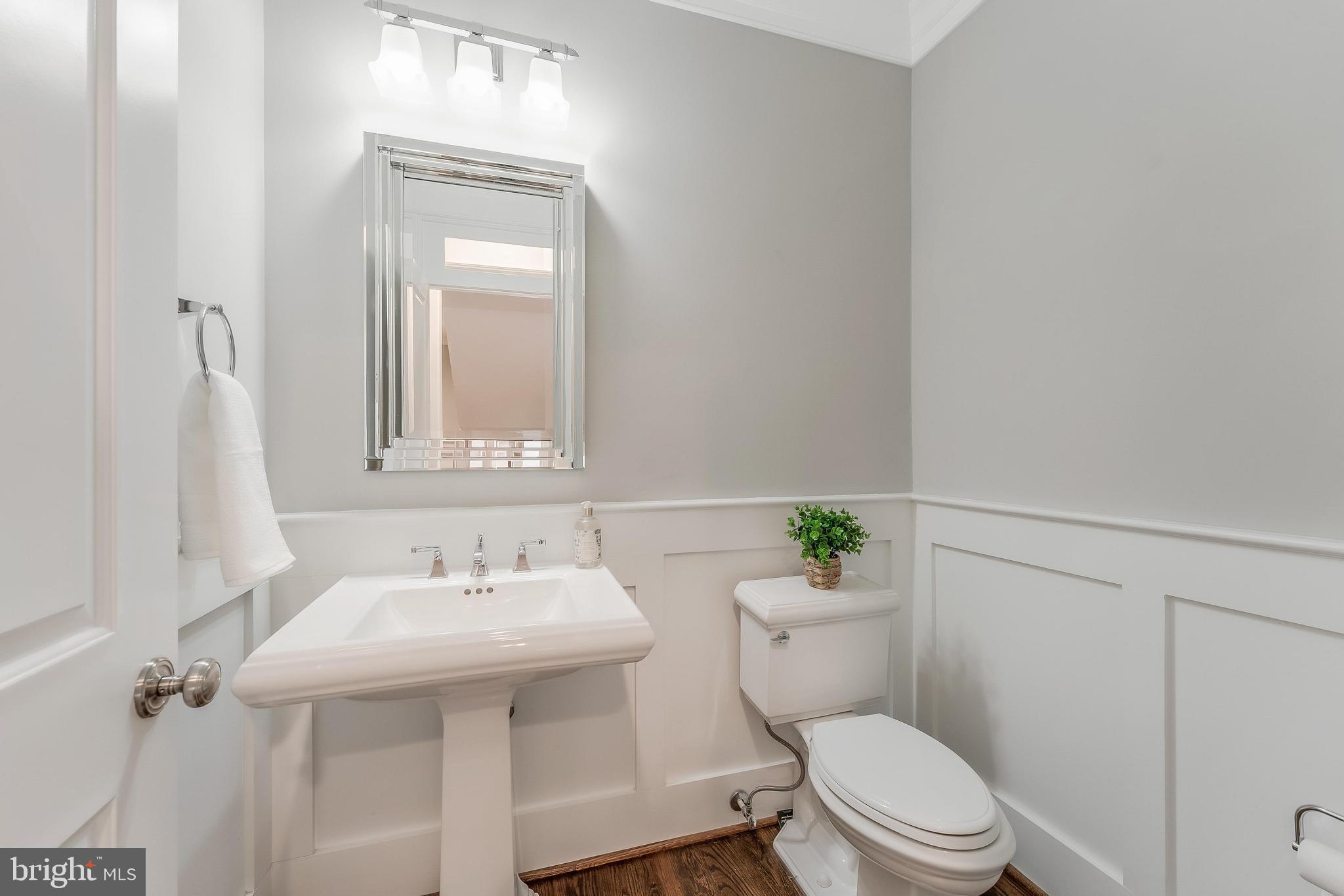 6805 Lumsden Street McLean, VA 22101 - Photo 10 of 123 a bathroom with a sink a toilet and a mirror