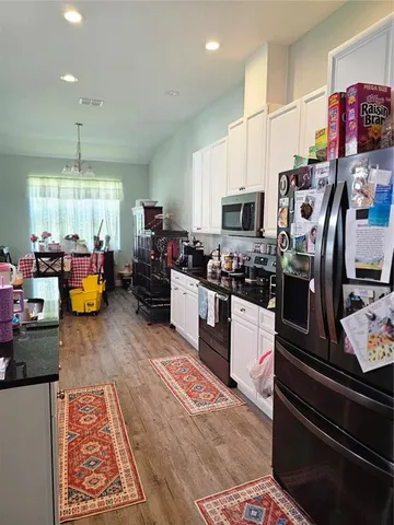 a kitchen with lots of counter top space and appliances