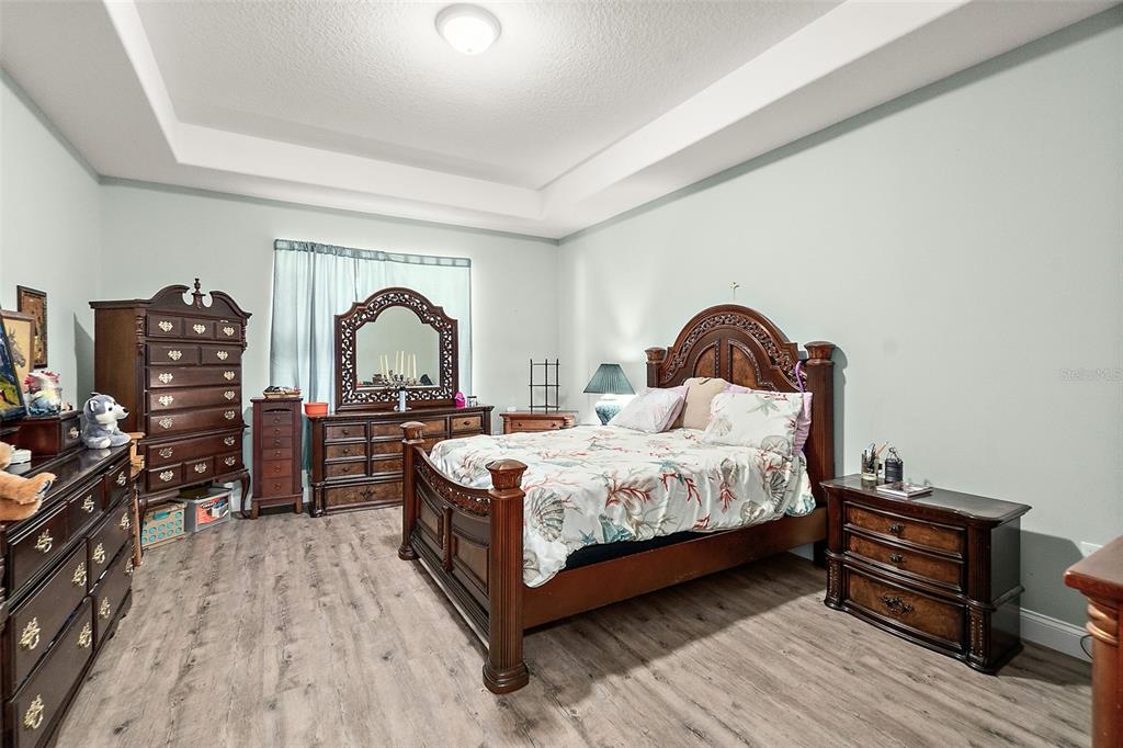 6 Wavecrest Place Palm Coast, FL 32164 - Photo 16 of 22 a bedroom with a bed and a large window