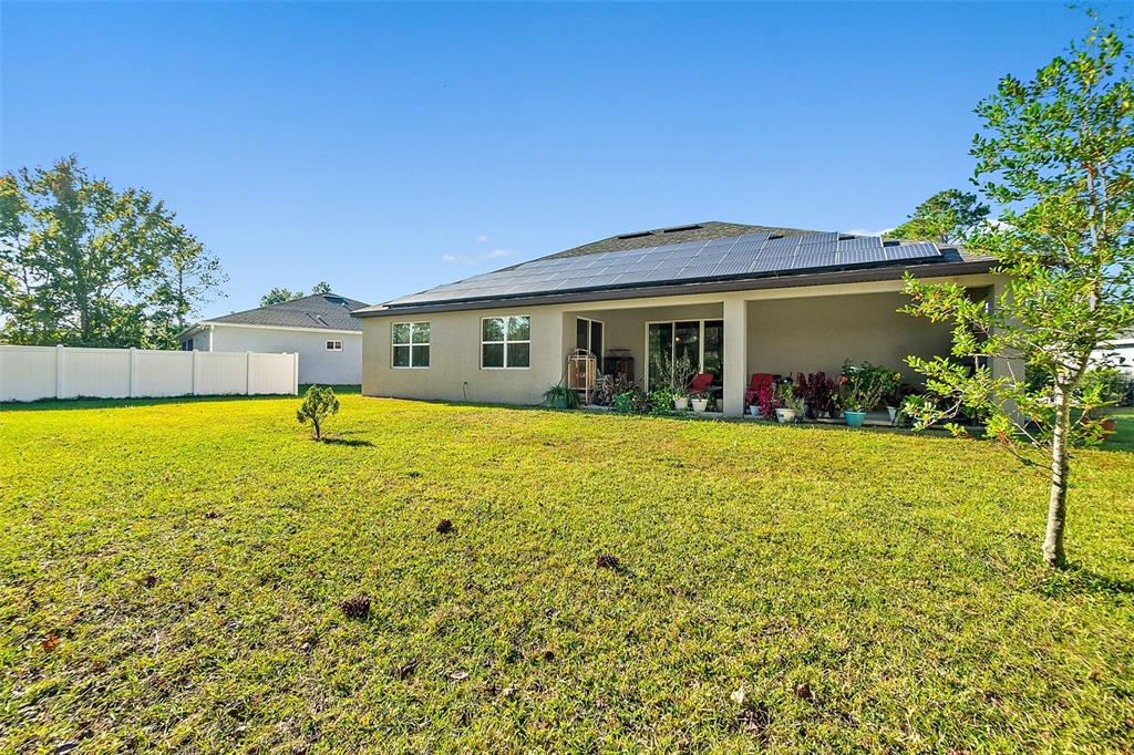 6 Wavecrest Place Palm Coast, FL 32164 - Photo 20 of 22 a view of a house with a big yard