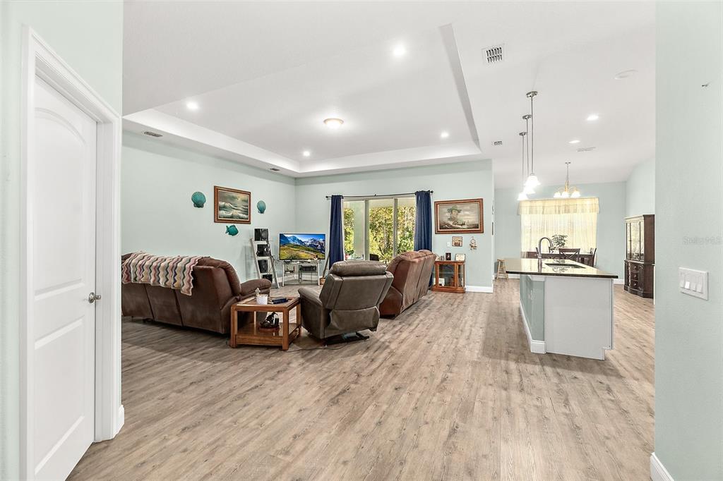 6 Wavecrest Place Palm Coast, FL 32164 - Photo 3 of 22 a living room with furniture and a wooden floor