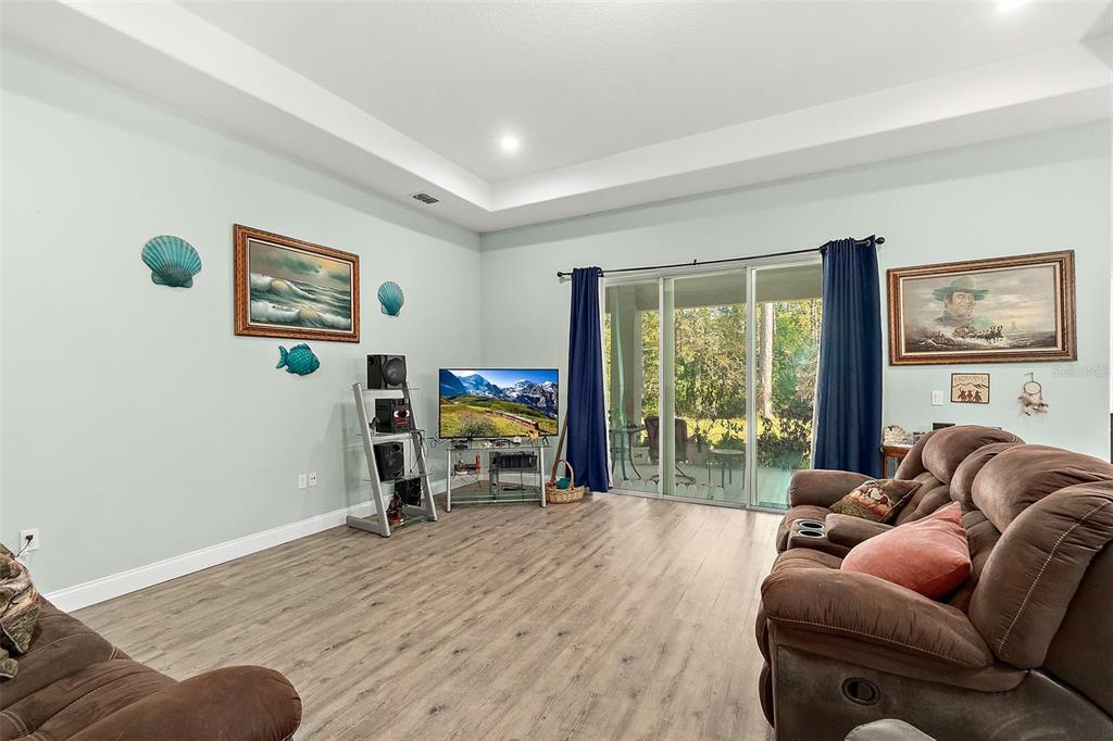 6 Wavecrest Place Palm Coast, FL 32164 - Photo 4 of 22 a living room with furniture and a flat screen tv