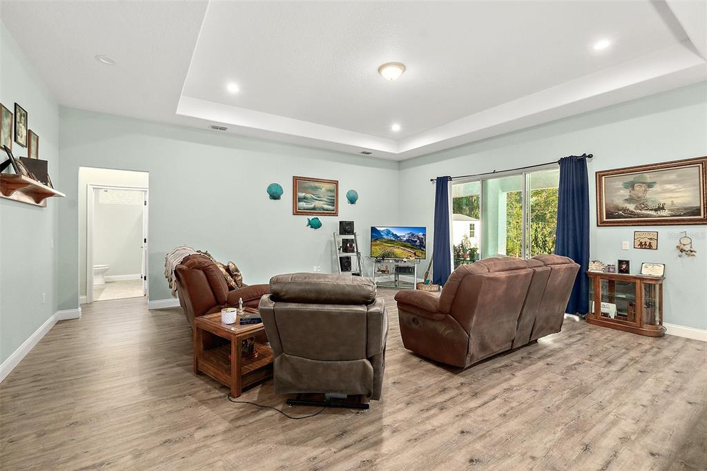 6 Wavecrest Place Palm Coast, FL 32164 - Photo 5 of 22 a living room with furniture and a flat screen tv